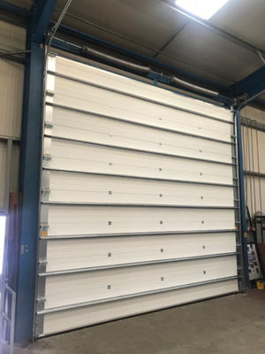 Electric / Manual Insulated Sectional Doors Anti Breaking For Warehouse Remote control electric panel steel material