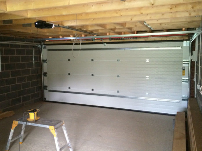 50mm-80mm Thickness Insulated Sectional Steel Doors Commercial With Optional Ventilation And Polyurethane Foam Insulation