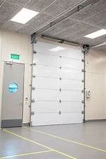 Waterproofing Automatic Industrial Sectional Door 40mm Finger Safe Panel Coated Steel